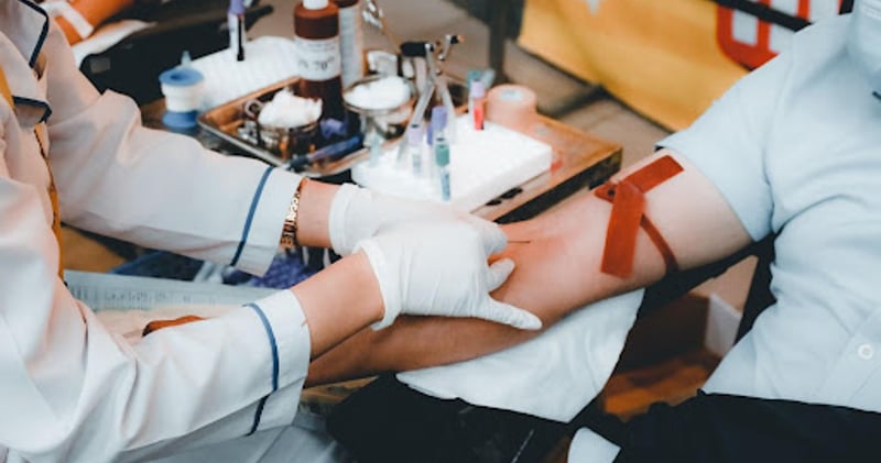 Phlebotomist drawing blood