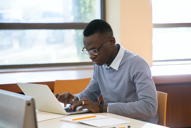 Young Man Working on a Computer