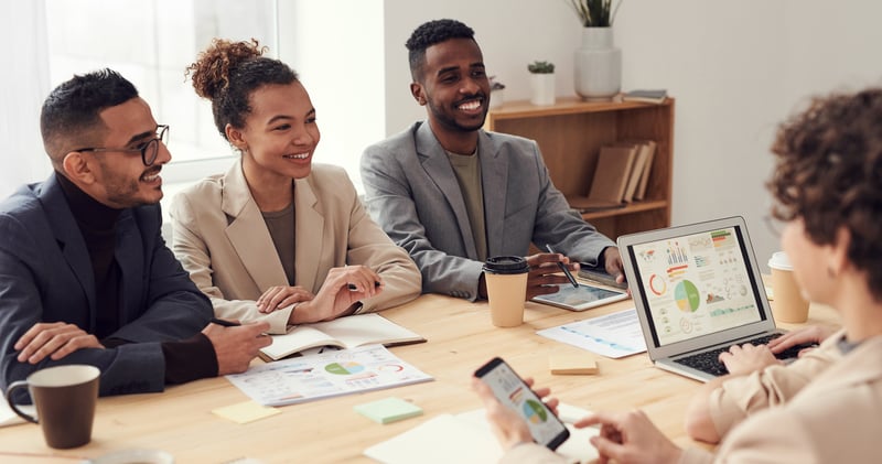 Coworkers smiling in meeting