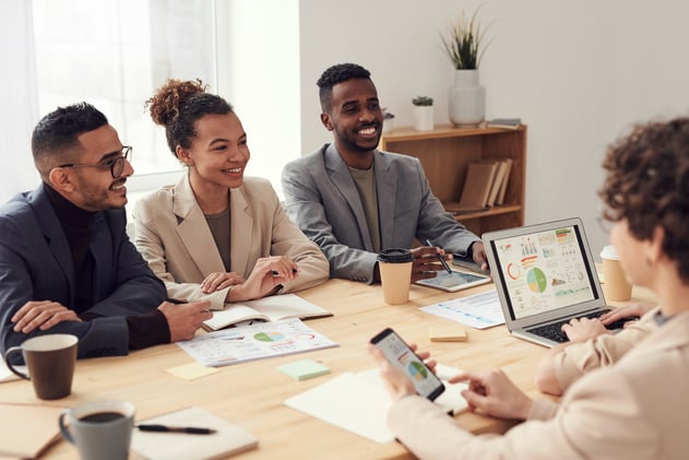 Coworkers smiling in meeting