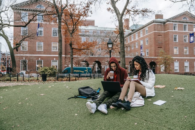 Man and Woman Studying at a Park

