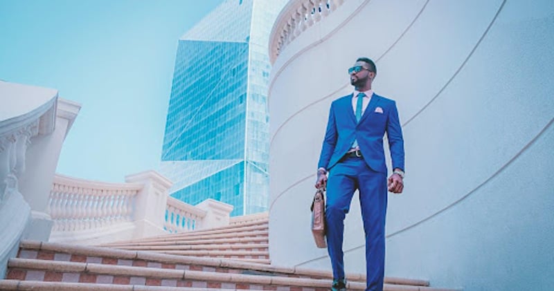 Man in suit walking down stairs